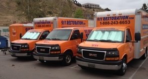 Water Damage Colleyville Vans And Trucks At Job Site