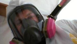 Mold Removal Technician With Gas Mask