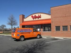 Water Damage Restoration Van Parked At Commercial Job