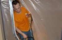 Water Damage Benbrook Technician Using Air Mover Near Vapor Barrier